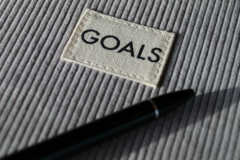 SMART goals - black and silver pen on gray textile
